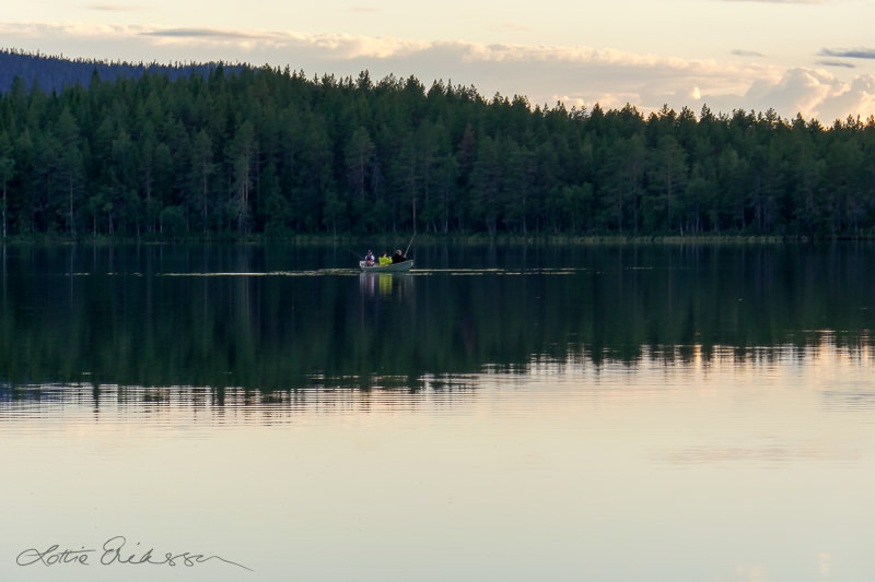 SE_lake_tranquil_reflection_rowboat_people_fishing
