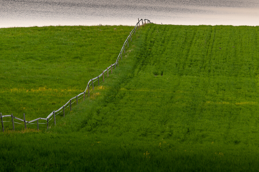SE_pasture_field_downhill_uphill_fence_lake_summer900