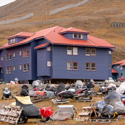 Svalbard Blue Houses Snowmobile Summerparking900